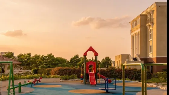 Children's play area with soft flooring beside the clubhouse