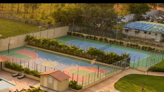 Outdoor sports courts, pool and play area seen from above